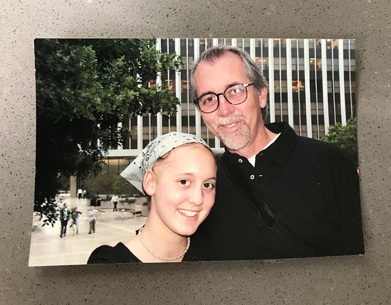 The author, age 11, with her dad, three months into her year-long chemotherapy treatment.