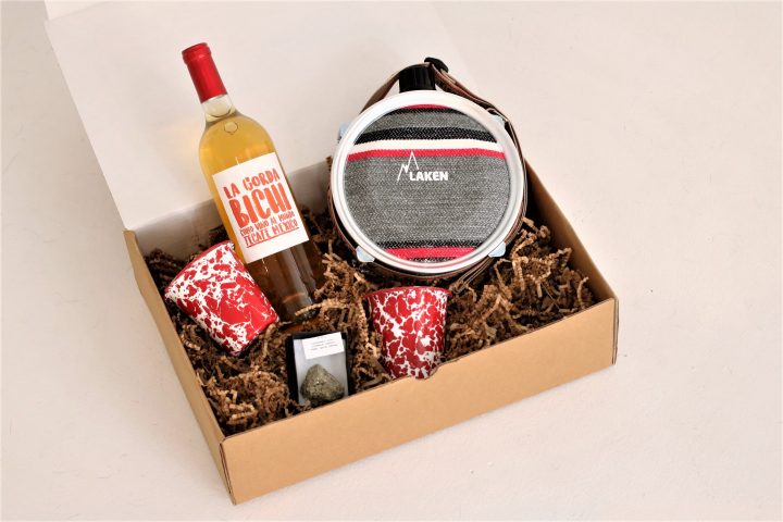 Gift box with bottle of white wine, canteen, and assorted gift items