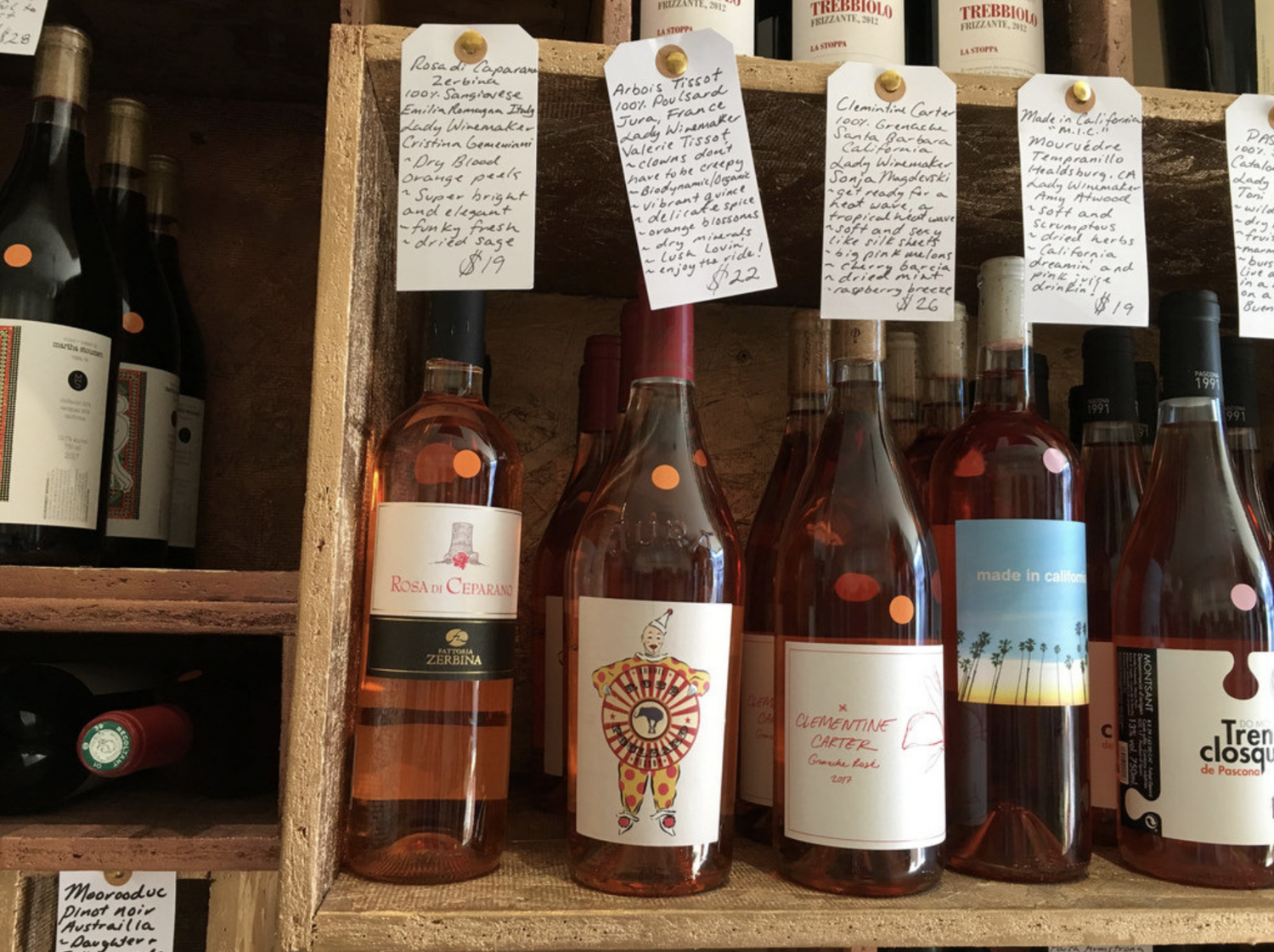 Closeup of wine bottles and hand written tasting notes
