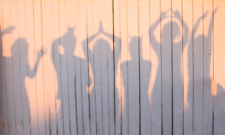 Silhouettes of people having fun and posing
