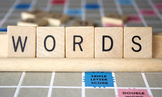 Scrabble letters spelling W-O-R-D-S