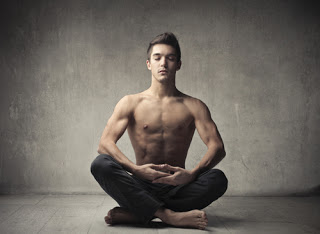 Hot topless man meditating