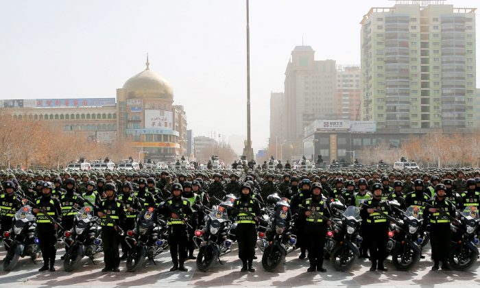 Chinese police attend an anti-terrorist oath-taking rally in Hetian, in northwest China's Xinjiang Uighur Autonomous Region on Feb. 27, 2017. (STR/AFP/Getty Images)