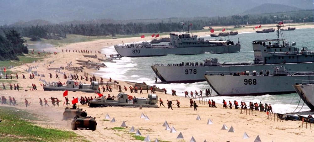 The People’s Liberation Army storms ashore from landing crafts in an exercise on the mainland coast close to Taiwan, on Sept. 10, 1999. (STR/AFP/Getty Images)