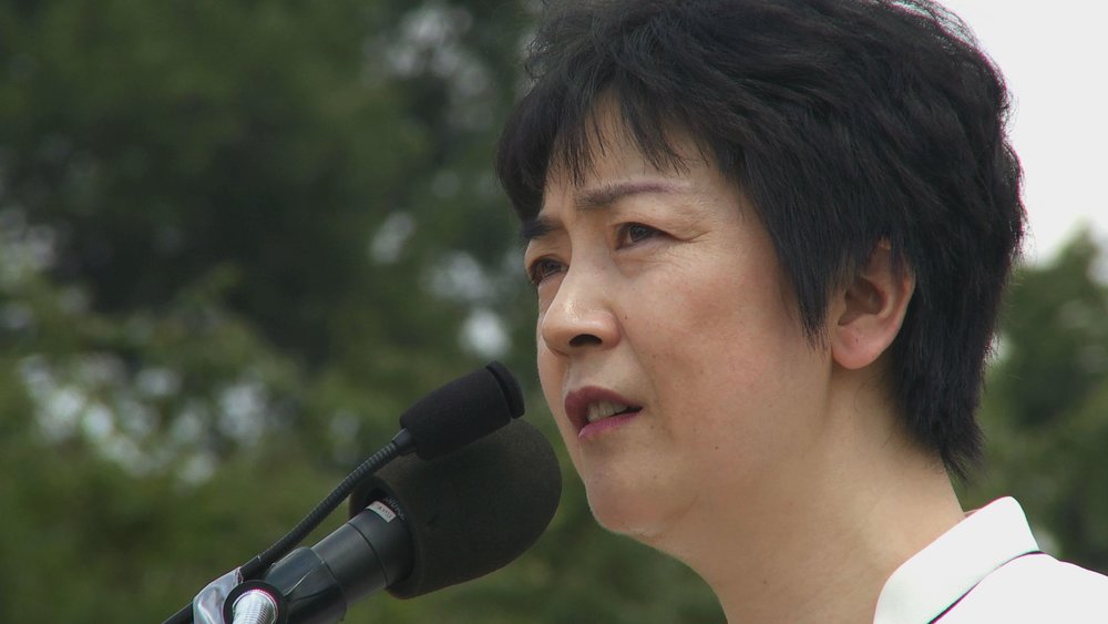 《自由中國》女主角曾錚2010年7月在華盛頓法輪功集會上發言。（圖片來自《自由中國》紀錄片）