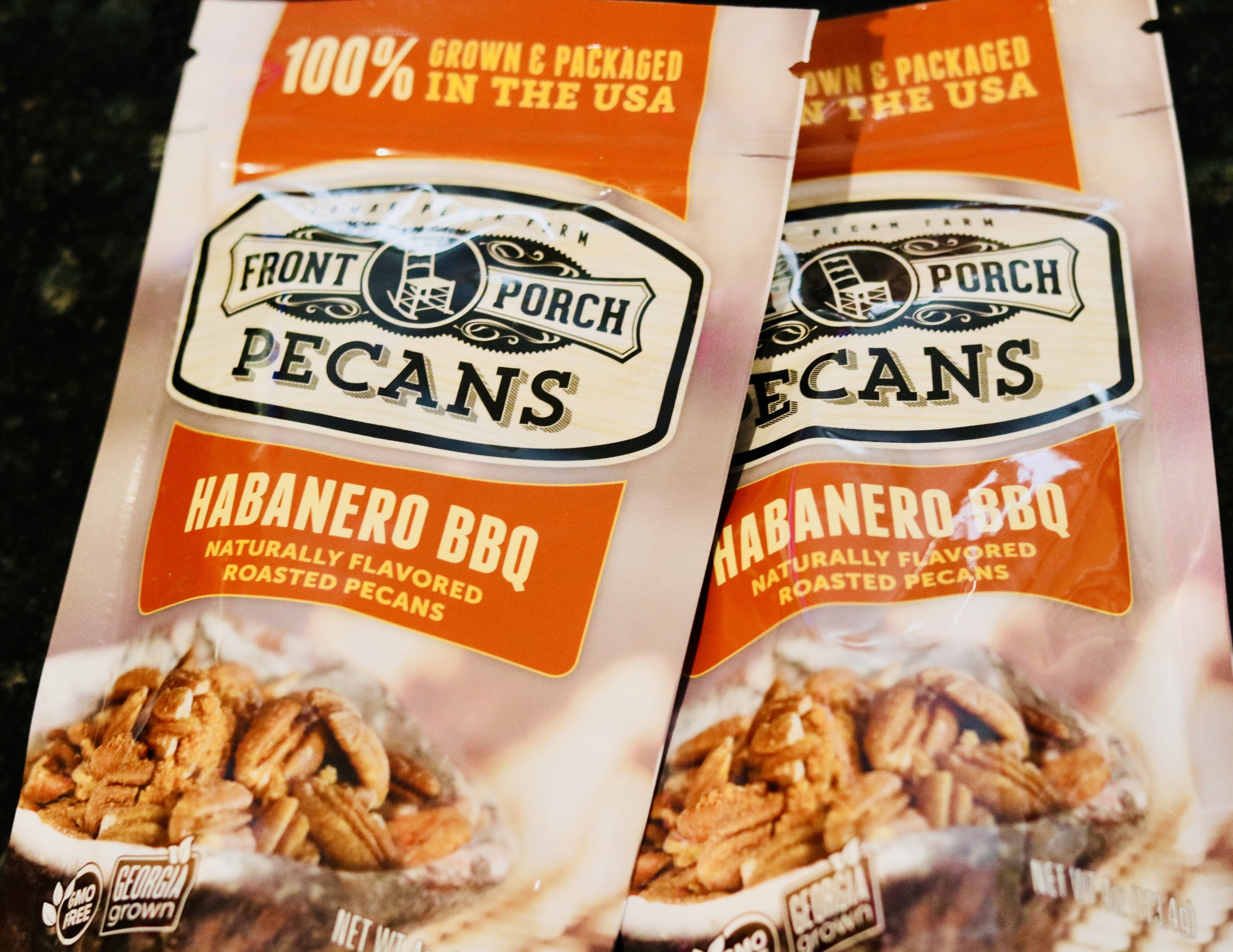 Two bags of Front Porch Pecans in Habanero BBQ flavor