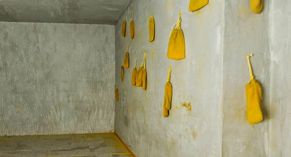 Minimalistic Room with Bags of Tumeric Hanging on the Walls