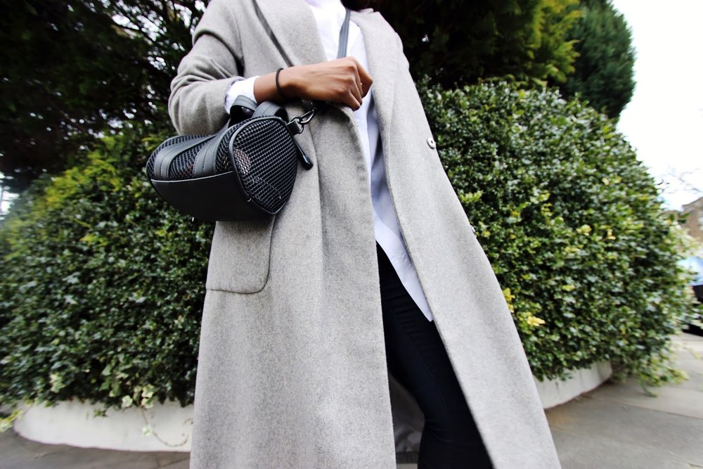 Grey over sized wool coat with all black timberland boots 