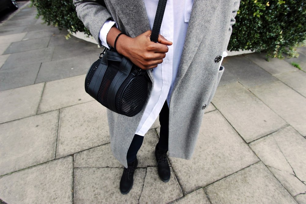 Grey over sized wool coat with all black timberland boots 