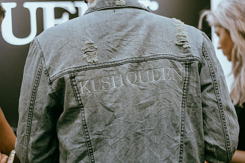 Back of denim jacket reading "Kush Queen"