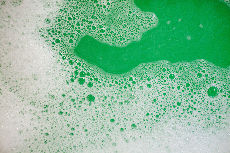 Green bath water from dissolved Relieve CBD bath bomb