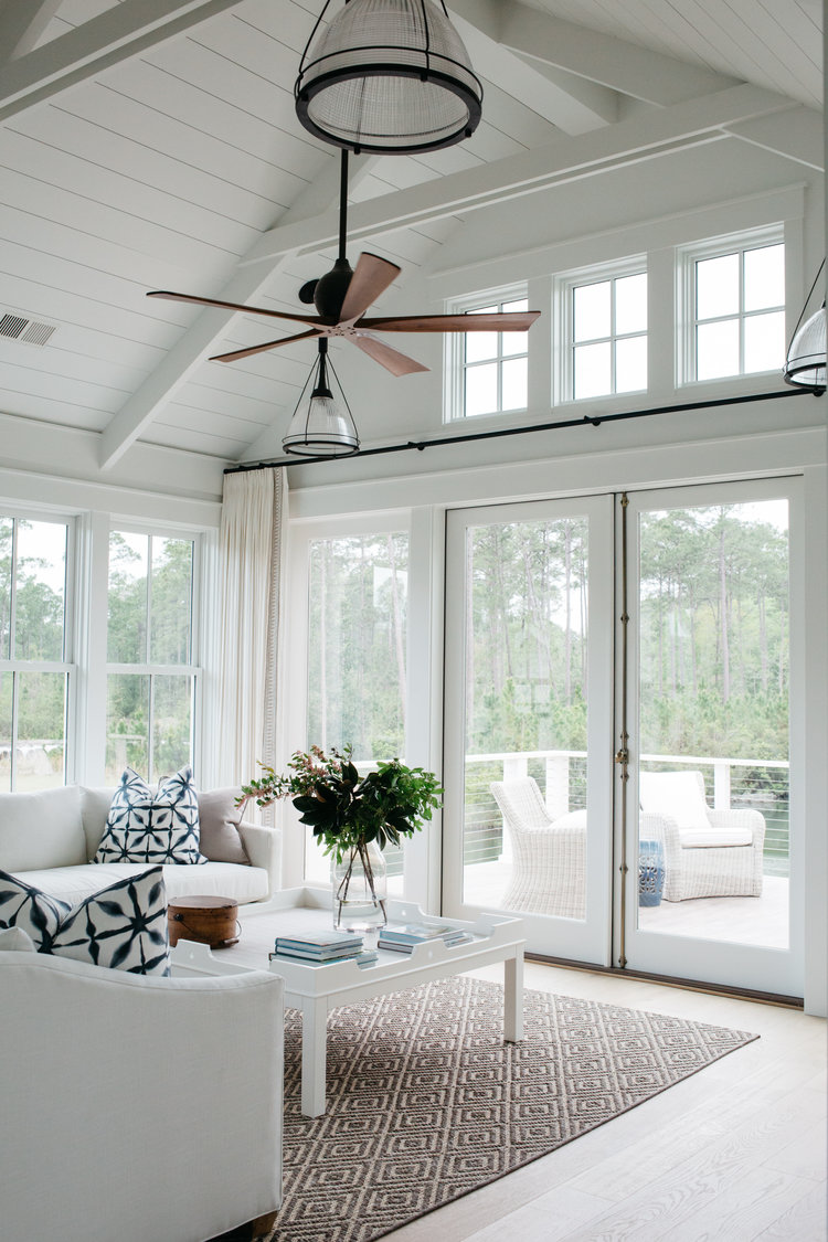 White living room with indigo blue accents. Coastal Cottage Interior Design Inspiration - Part 1 {Get the Look!} #livingroom #cottagestyle #coastaldecor