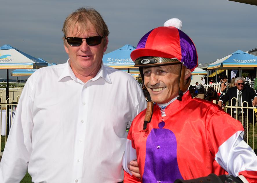  Trainer Kelly Schweida and jockey Damien Browne after Oink's win at Doomben. Image provided by News Limited.&nbsp; 