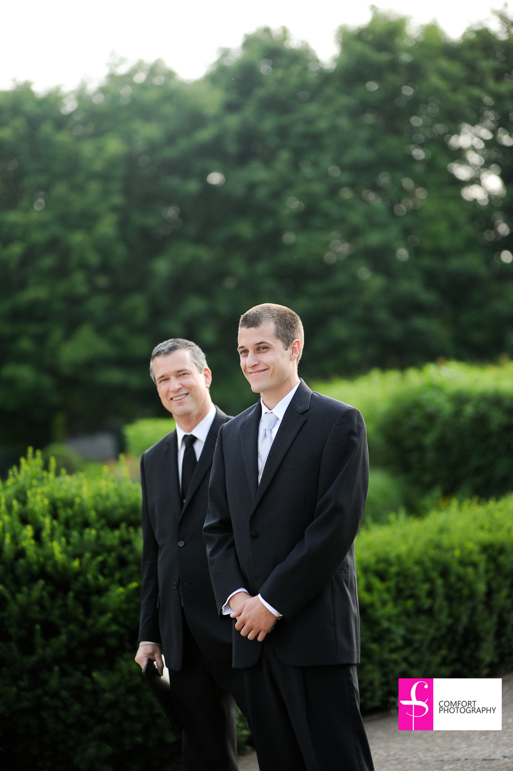 Groom with wedding officiant, Damian King, waiting for his bride in Columbus, Ohio at Franklin Park Conservatory
