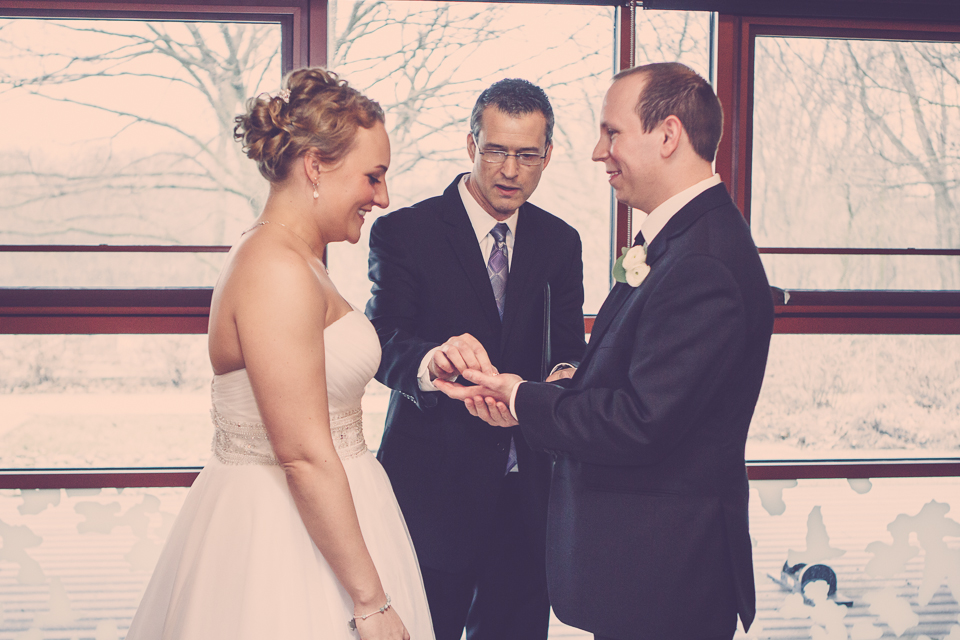 wedding ring placed by officiant in groom's hand in Columbus Ohio