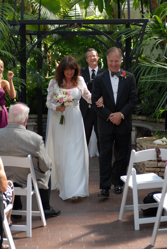 Damian King as wedding officiant with Pam and Rick in Palm House wedding