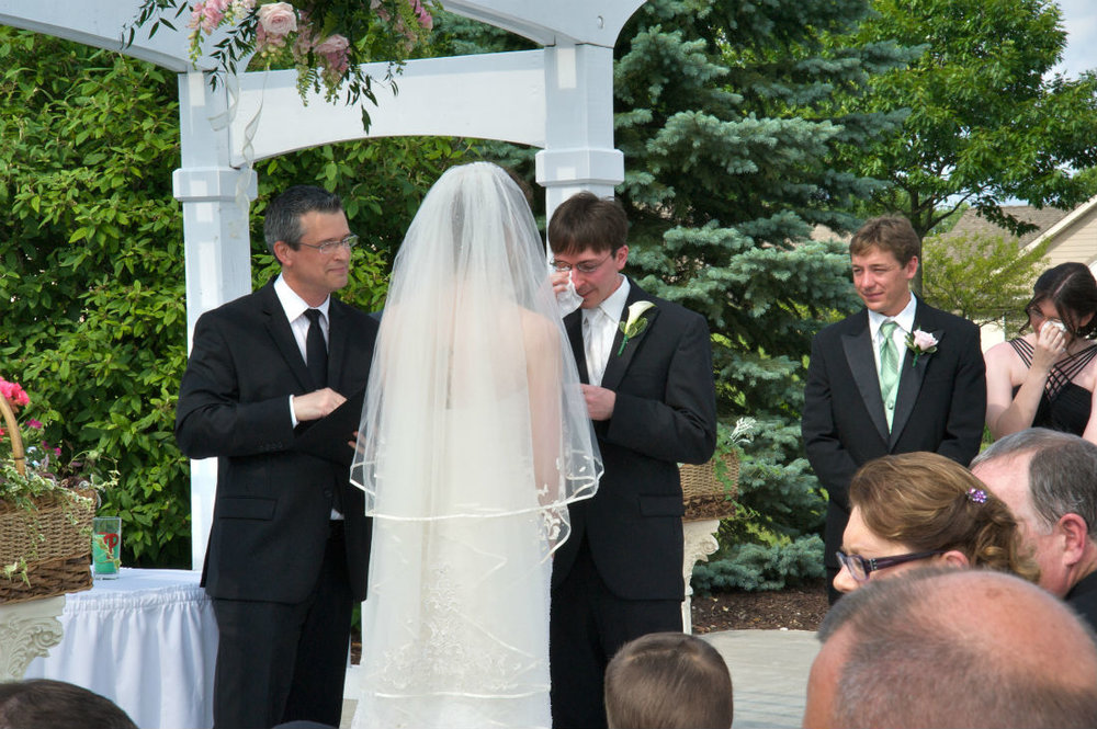 Justin expresses emotion for his bride during his wedding ceremony in Hilliard, Ohio