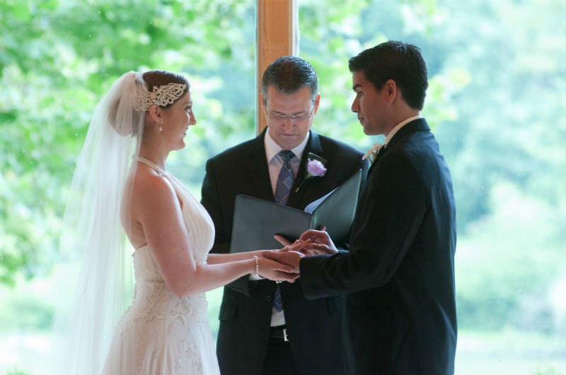Damian King witnesses as wedding officiant as Diego gives the ring to his bride at Darby House, Galloway, Ohio