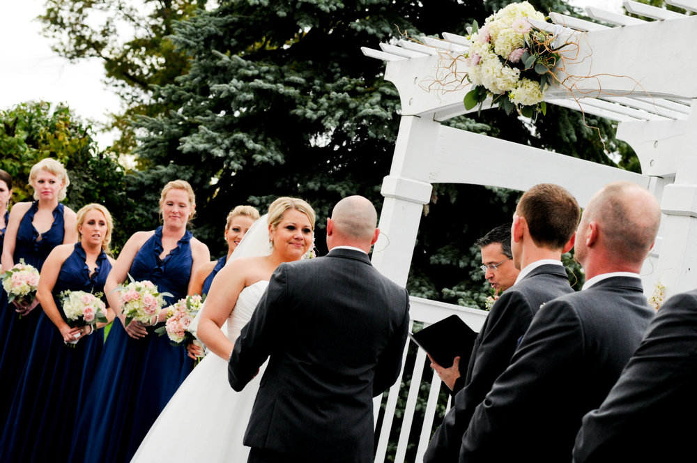 Bride, groom, bridal party, and wedding officiant, Damian King, in Columbus Ohio