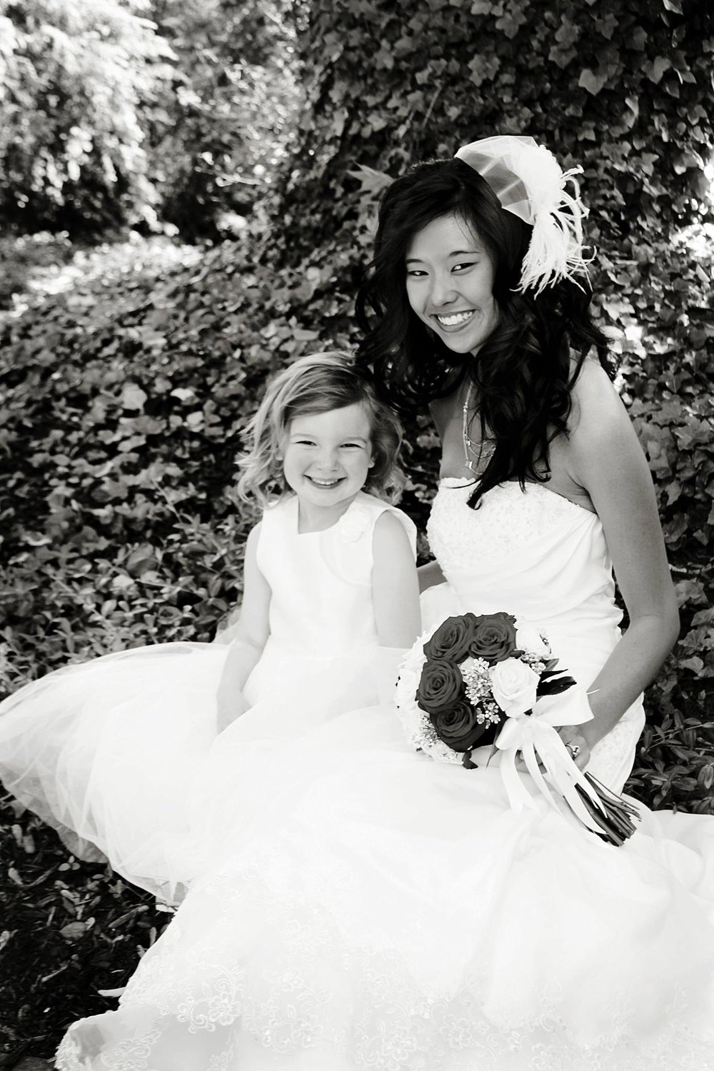 Bride with bouquet in Columbus Ohio. Flower girl smiles after wedding. Damian was officiant