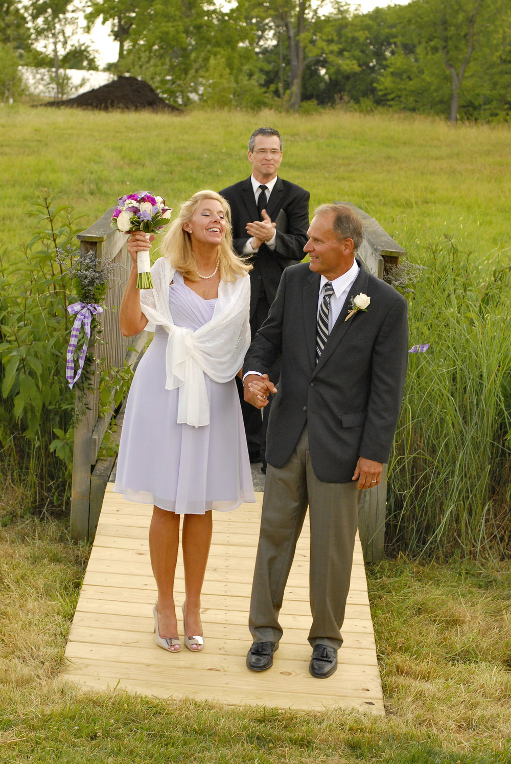 Bride with smile and bouquet at her Columbus area wedding