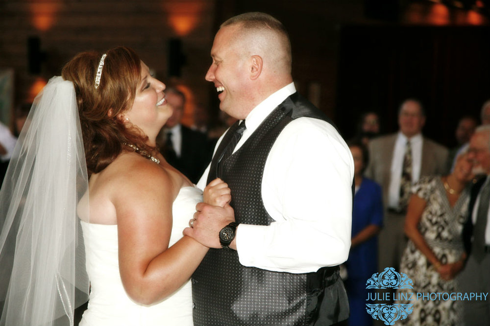 Bride and groom enjoying a dance at wedding venue Four Seasons in Columbus. Damian King, officiant
