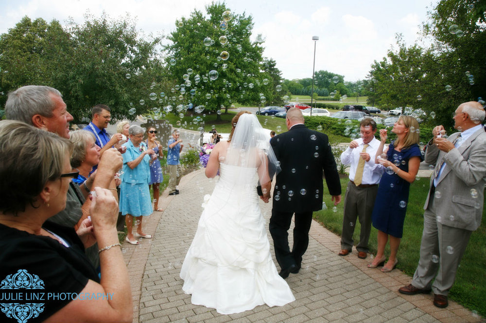 Approaching their limousine, Sarah and Brent, now married at Four Seasons wedding venue in Hilliard Ohio