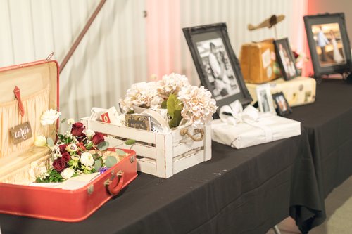An Aviation Themed Wedding Welcome Table Using Vintage Suitcases.