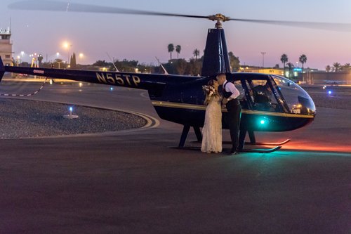 A Bride And Groom Depart By Helicopter For Their Aviation Wedding Themed Grand Exit.