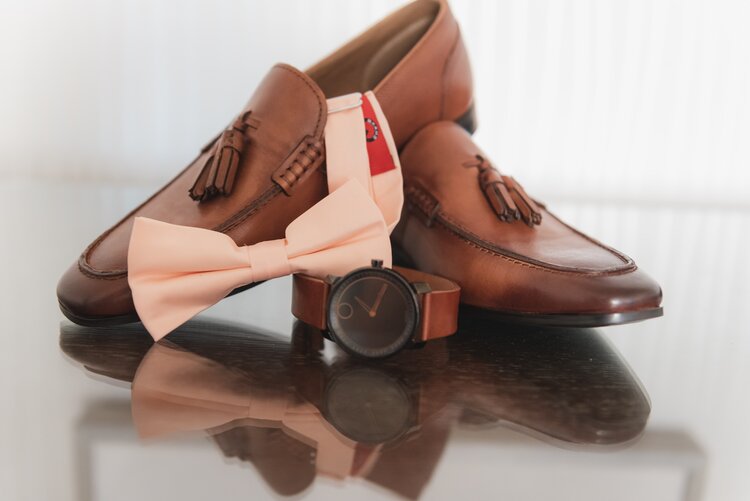 A Stylish Pair Of Brown Wedding Shoes, Matching Brown Watch, And A Pink Bow Tie.