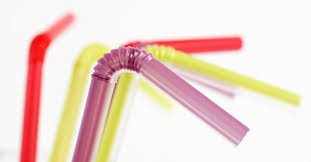 Photo of five different colored bendy plastic straws