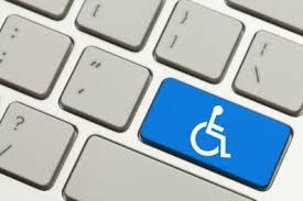 Picture of a gray computer keyboard with one key blue with a white wheelchair symbol
