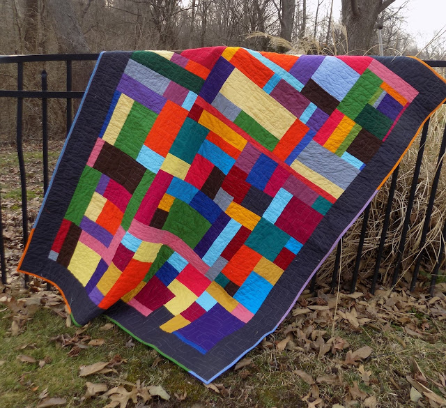 solid fabric improv quilt fence.jpeg