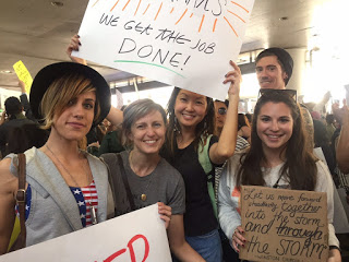 Maurene Goo (center) protesting at LAX with authors Kirsten Hubbard, Sarah Enni, Victoria Aveyard and Alex Kahler 