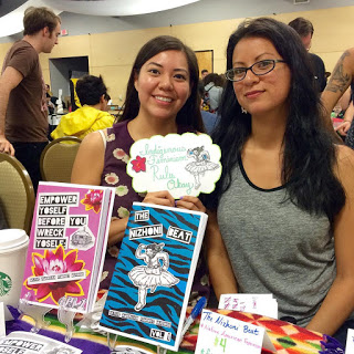 Amber and Melanie with a display of their zines