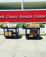 boxes of books to be donated to Cook County Juvenile Center