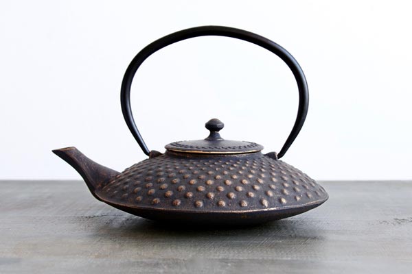 distressed black and gold cast iron hobnail teapot