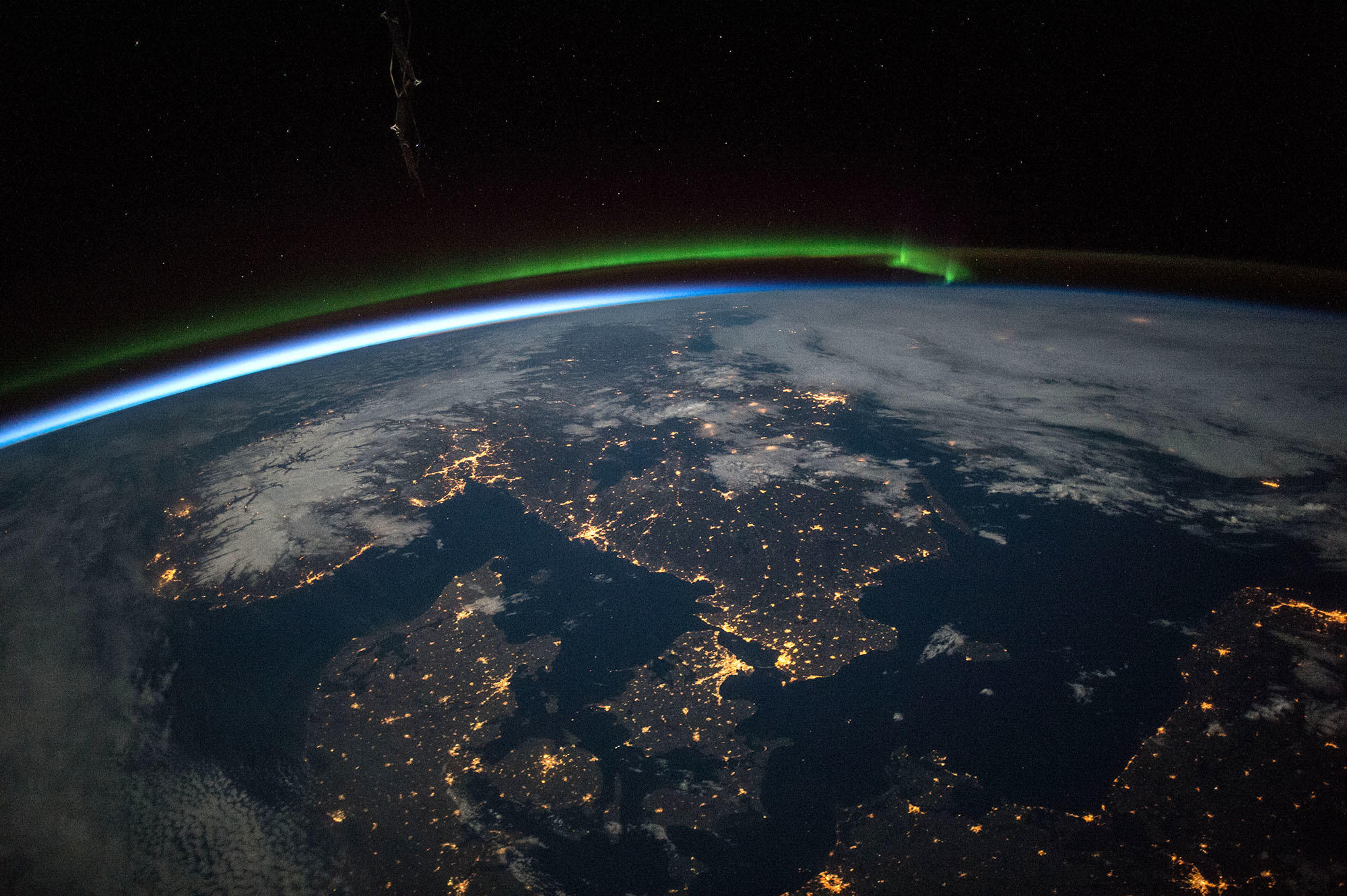 overview of Earth from space with city lights shining