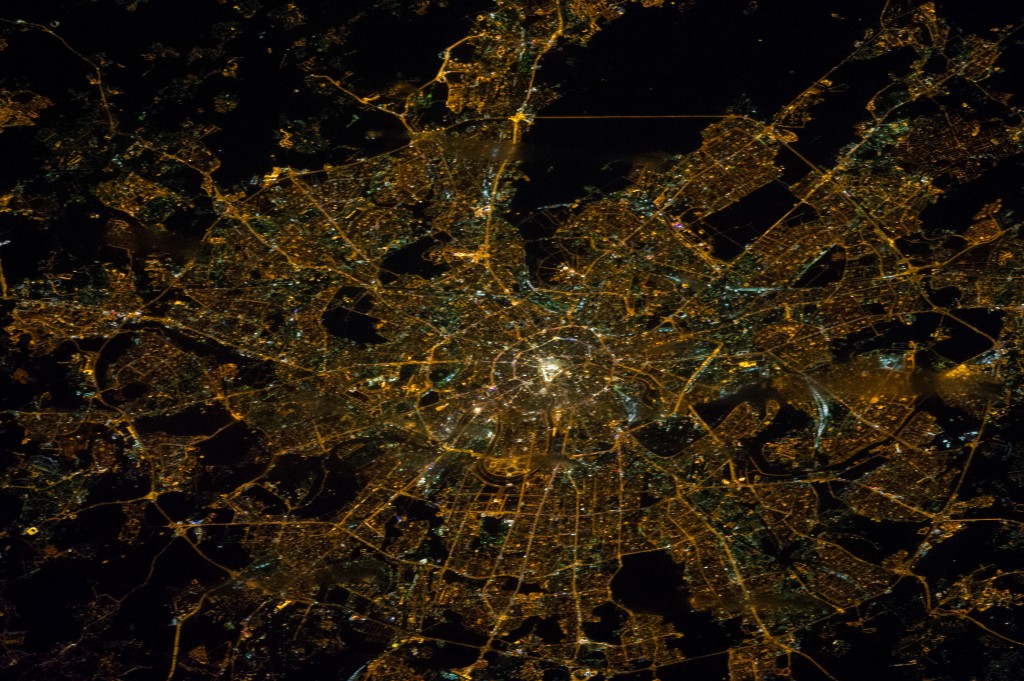 dense city lights and streets shown from space