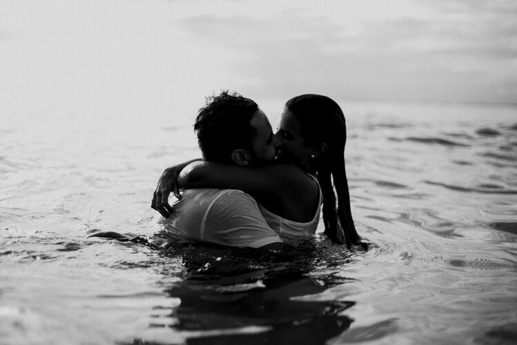 man-and-woman-kissing-together-on-body-of-water-1001445.jpg