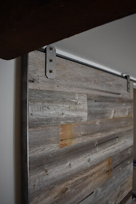 grey reclaimed wood barn door for a heritage home in Vancouver