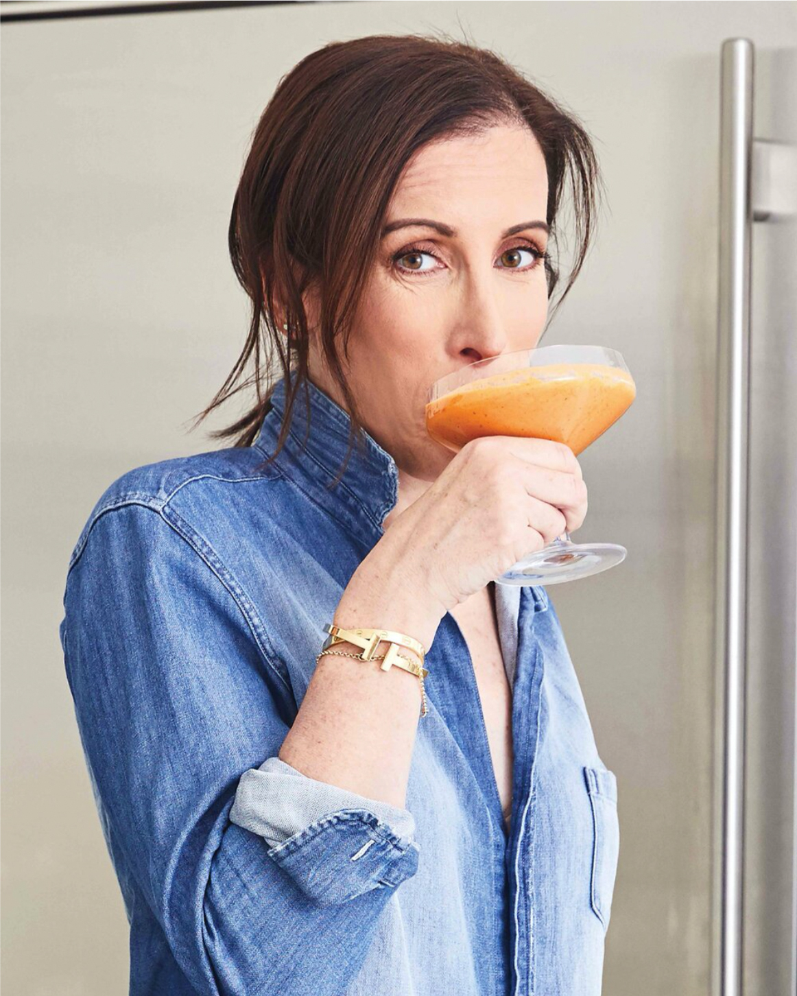 portrait of Julie Albert drinking a beverage