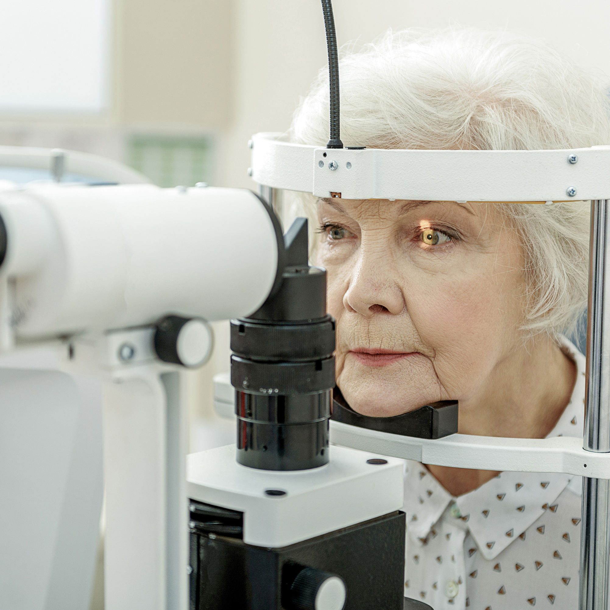 elderly woman getting an eye exam