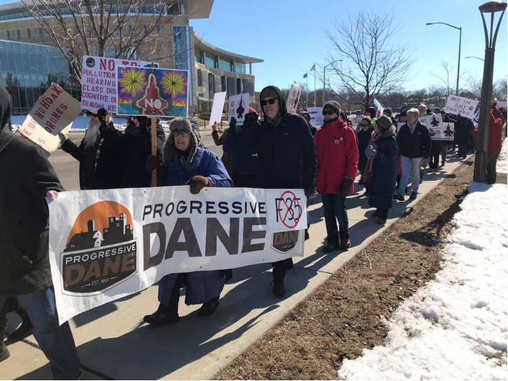 progressive dane banner at public rally