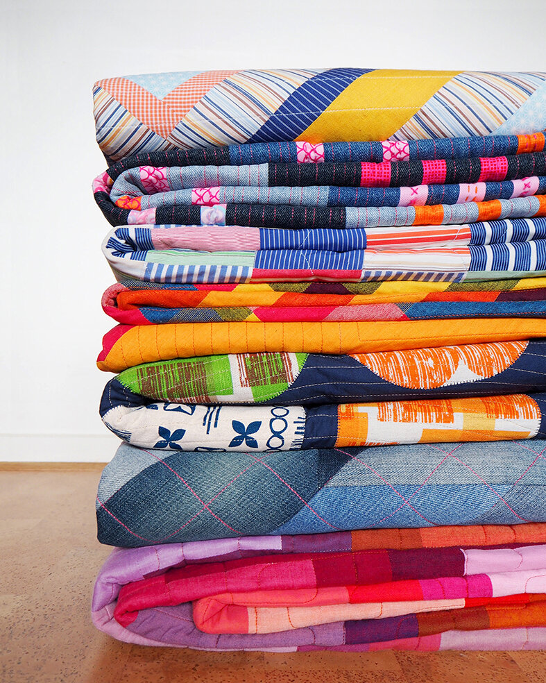 Stack of Stitch & Yarn quilts