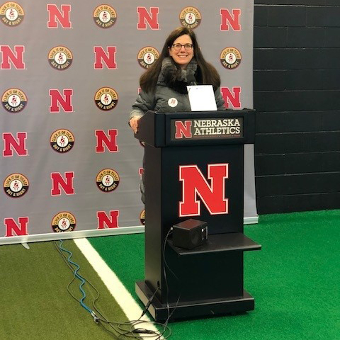 Amy Dufrane speaking at Nebraska Athletics