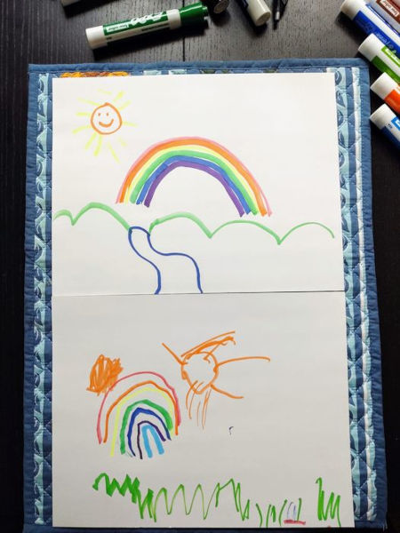father and son drawings of sunny rainbow