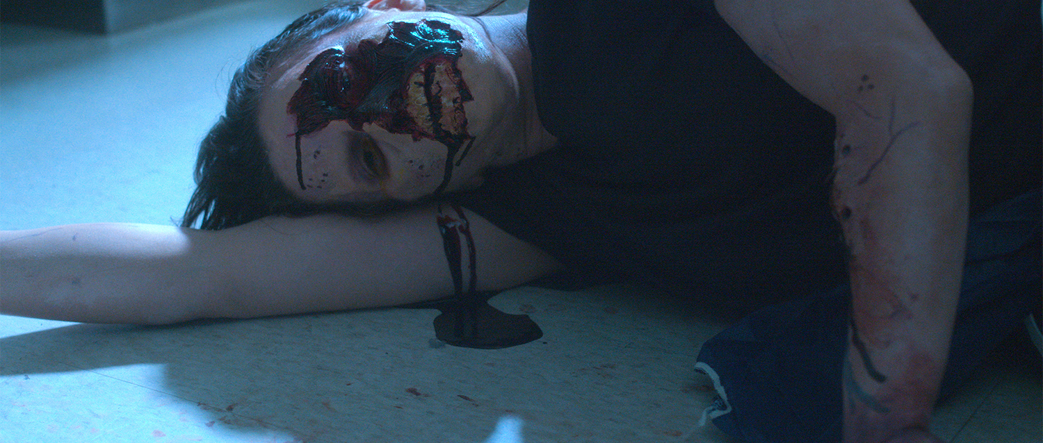 An actress lies on the floor of a lab in the short film Nova
