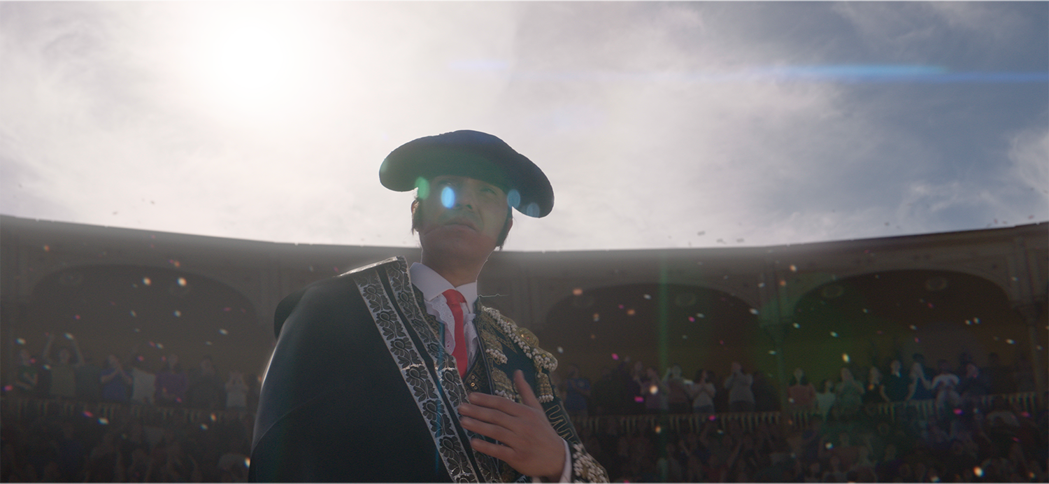A bullfighter poses for an enthusiastic crowd for the short film Toro de Oro, bullfighting arena, crowd, and particle sim by Foxtrot X-Ray