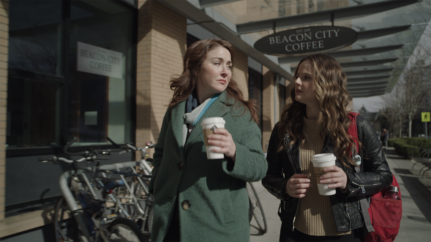 Actresses walk outside a re-branded coffee shop in the film Past Never Dies, with VFX completed by Foxtrot X-Ray